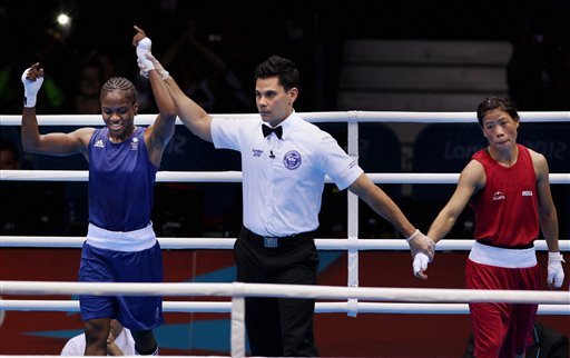 Great Britain's Nicola Adams, left, and India's Chungneijang Mery Kom Hmangte react following a women's flyweight 51-kg semifinal boxing match at the 2012 Summer Olympics
