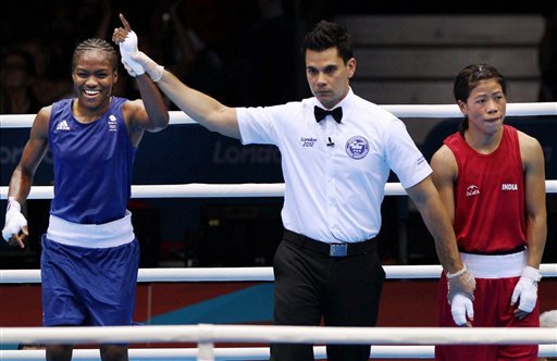 Great Britain's Nicola Adams, left, and India's Chungneijang Mery Kom Hmangte react following a women's flyweight 51-kg semifinal boxing match at the 2012 Summer Olympics
