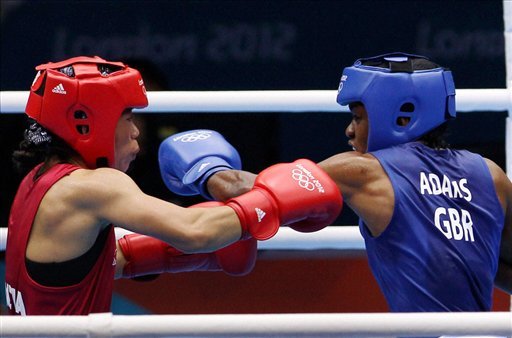 Great Britain's Nicola Adams, right, and India's Chungneijang Mery Kom Hmangte fight during their women's flyweight 51-kg semifinal boxing match
