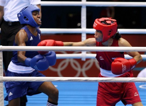 Great Britain's Nicola Adams, right, and India's Chungneijang Mery Kom Hmangte fight during their women's flyweight 51-kg semifinal boxing match
