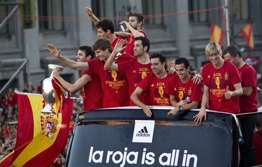 Spain's  soccer team players show the Euro cup as they wave to supporters at Cibeles Square in Madrid, Spain
