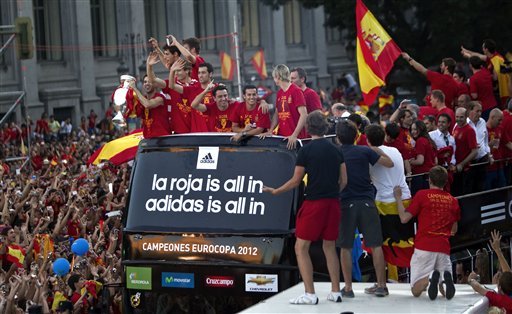 Spain's  soccer team players show the Euro cup as they wave to supporters at Cibeles Square in Madrid,
