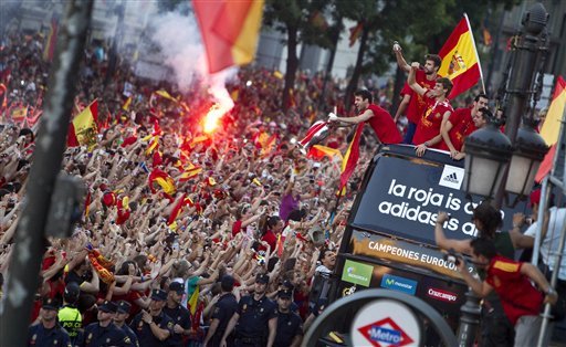 Spain  players show the Euro cup as they wave supporters at Cibeles Square in Madrid, Spain
