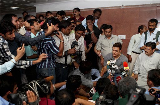 Aamir Khan and Union Minister for Social Justice and Empowerment Mukul Wasnik interact with the media after a meeting in New Delhi on Monday
