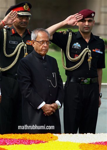 <br/>
New Delhi: President-elect Pranab Mukherjee pays homage at Rajghat before taking oath as India's 13th President, in New Delhi on Wednesday. PTI <br/>
 
