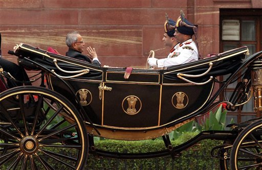 President Pranab Mukherjee and outgoing President Pratibha Patil ride the regal buggy during guard of honour ceremony
