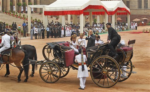President Pranab Mukherjee and outgoing President Pratibha Patil ride the regal buggy during guard of honour ceremony
