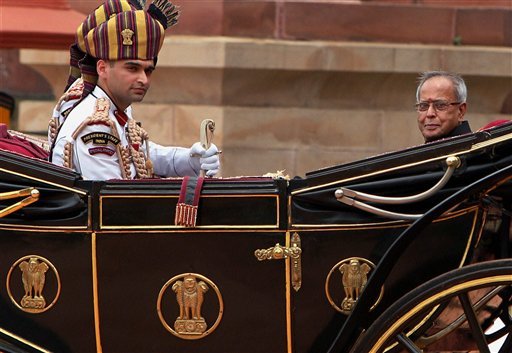 President Pranab Mukherjee and outgoing President Pratibha Patil ride the regal buggy during guard of honour ceremony
