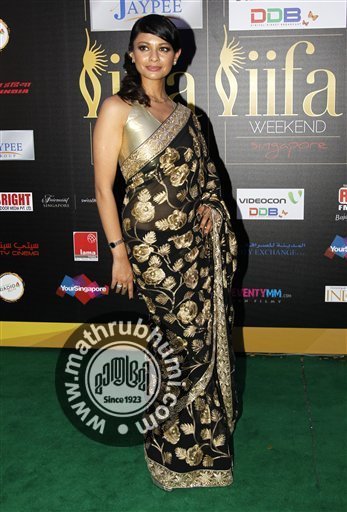 Bollywood actresses Pooja Kumar, arrives on the 'green carpet' for the Jaypee International Indian Film Academy (IIFA) awards held on Saturday June 9, 2012 in Singapore 
