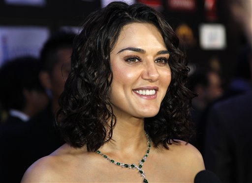 Bollywood actress Priti Zinta arrives on the 'green carpet' for the Jaypee International Indian Film Academy (IIFA) awards held on Saturday June 9, 2012 in Singapore<br/>
 

