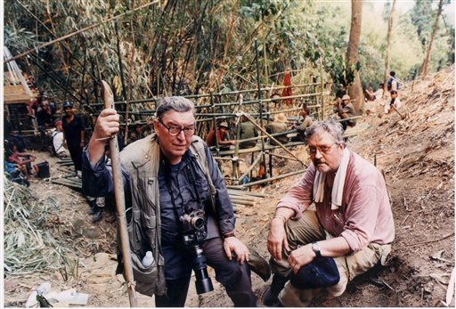 Horst Faas, left, and former AP Saigon bureau chief Richard Pyle pose at a Laos crash site, as a U.S.

