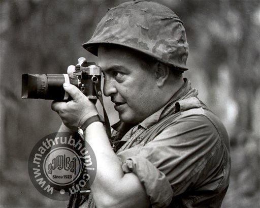 In this 1967 file photo Associated Press photographer Horst Faas works in Vietnam. Faas, a prize-winning combat photographer who carved out new standards for covering war with a camera and became one of the world's legendary photojournalists in nearl
