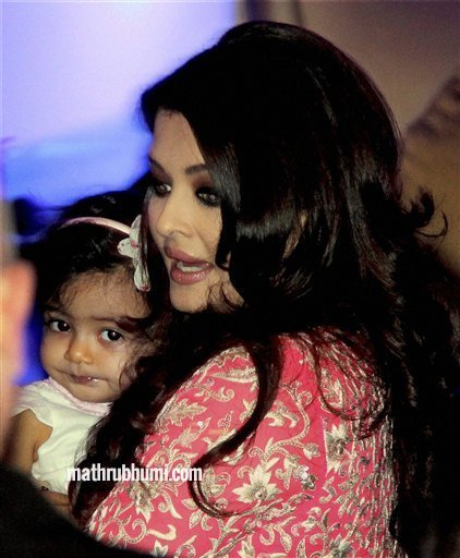 <br/>
Bollywood actress Aishwarya Rai Bachchan holds her daughter Aradhya after she was conferred with the French civilian award, Officer Dan Ordre Arts et des Lettres in Mumbai on Thursday. PTI Photo 
