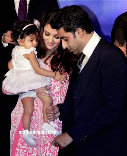 <br/>
Bollywood actress Aishwarya Rai Bachchan holds her daughter Aradhya after she was conferred with the French civilian award, Officer Dan Ordre Arts et des Lettres in Mumbai on Thursday. PTI Photo 
