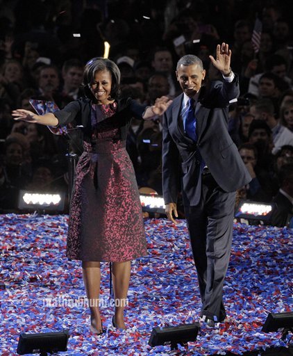 Barack Obama, accompanied by first last Michelle Obama and daughters Malia and Sasha arrive at the election night party 
