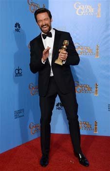 Actor Hugh Jackman poses with the award for best performance by an actor in a motion picture - comedy or musical for 'Les Miserables' backstage at the 70th Annual Golden Globe Awards
