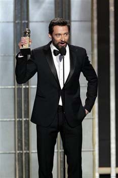 Actor and director Ben Affleck poses with the award for best motion picture - drama for 'Argo' backstage at the 70th Annual Golden Globe Awards 
