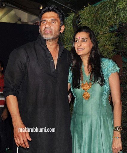 Bollywood Actor Sunil Shetty with his wife Mana Shetty during the launch of their furniture showroom in Mumbai on Saturday night . PTI  
