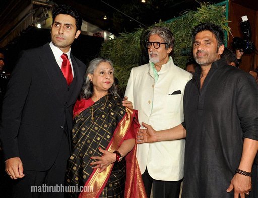 Bollywood actor Amitabh Bachchan with his family pose with Sunil Shetty during the launch of his furniture showroom in Mumbai on Saturday night . PTI  
