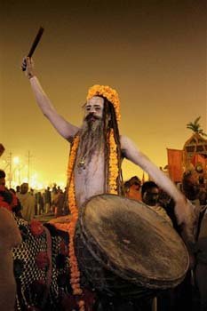 Hindu holy men, or Naga Sadhus, celebrate naked in the water at Sangam
